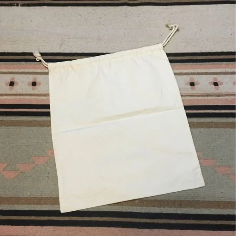 Johnny Was medium Off White drawstring dustbag logo on front Garment bag
